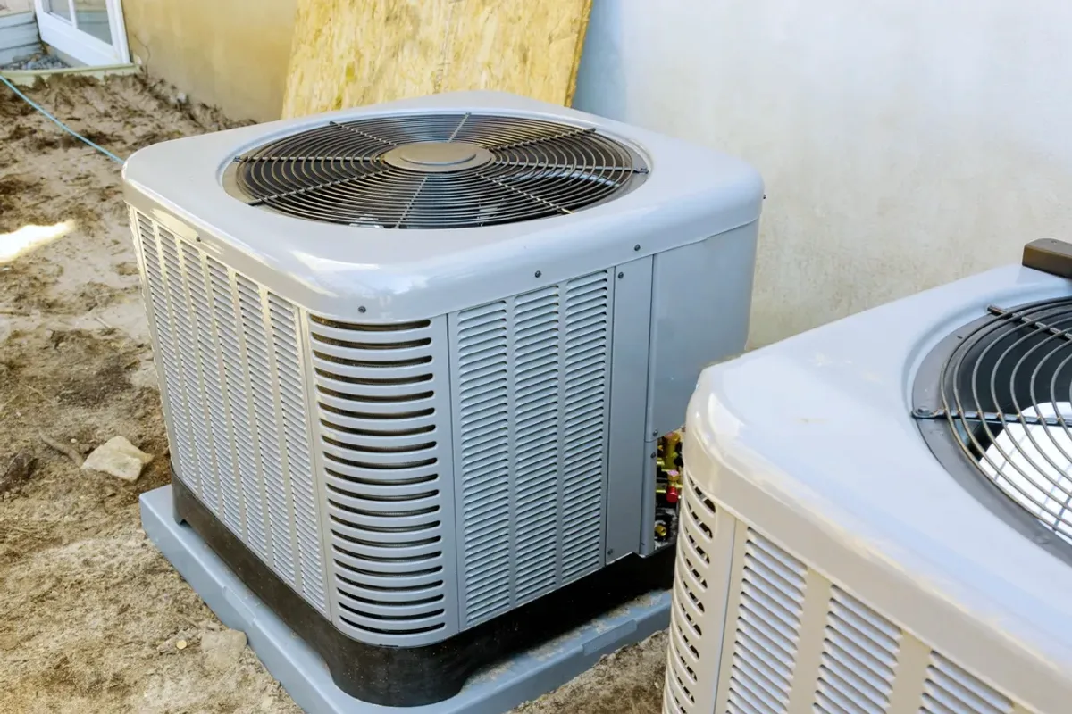 Two outdoor air conditioner condensers