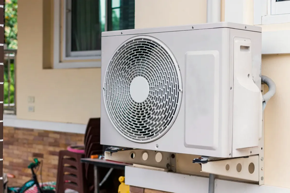 Outdoor heat pump unit on a wall bracket